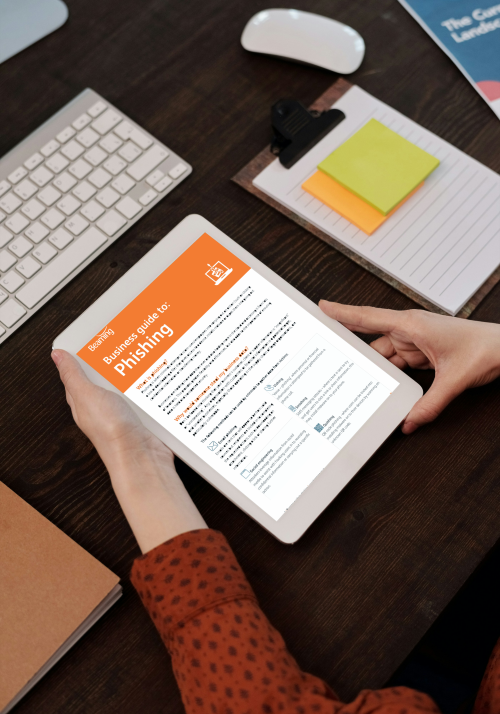Business Guide to Phishing shown on a laptop.